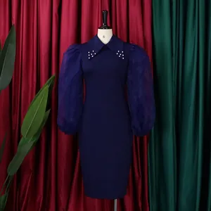 Elegant navy blue pencil dress featuring beaded collar and sheer mesh puff sleeves