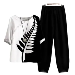 Ensemble élégant 2 pièces femme avec haut imprimé feuille et pantalon large noir
