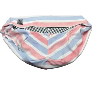 Striped pet sling carrier for cats and small dogs, comfortable outdoor travel crossbody bag.