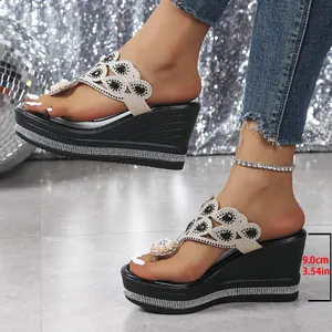 Detail view of women's wedge sandals with 9cm heel and sparkling rhinestone embellishments
