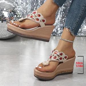 Detail view of ethnic style wedge sandals with red rhinestones and 9cm heel height