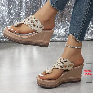 Close-up of 9cm platform wedge sandals featuring ornate rhinestone details and pearls