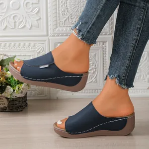 Navy blue peep-toe wedge sandals for women featuring stylish white stitching details