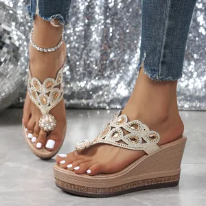 Detailed view of rhinestone and pearl embellished platform wedge sandals for summer