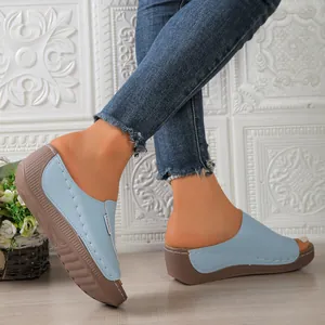 Detailed side view of stylish sky blue women's platform wedge sandals with peep-toe design