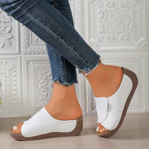 Stylish white peep-toe platform wedge sandals for women with casual strap design.