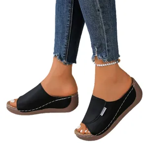 Stylish black peep toe wedge sandals for women with thick soles and white stitching.