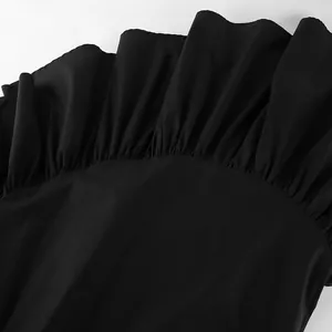 Close-up detail showing the ruffled hem and fabric texture of a black French style skirt