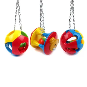 Detailed view of three colorful hanging bird bell balls with sturdy metal chains for parrot chewing.