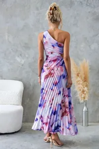 Back view of an elegant one-shoulder floral pleated maxi dress featuring a waist cutout detail.
