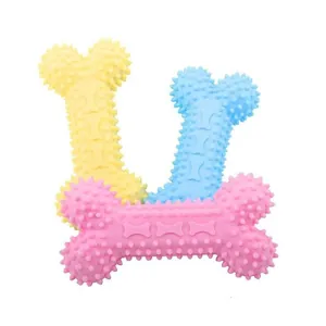Durable spiked TPR bone-shaped dog chew toys in pink blue and yellow for dental care