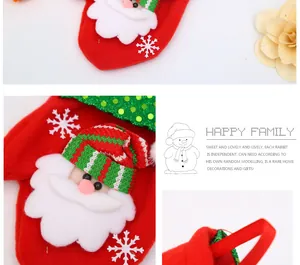 Detailed view of red Christmas stocking with Santa Claus applique and green sequins.