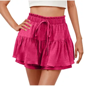 Close-up detail of women's vibrant fuchsia ruffled skort with comfortable drawstring waist.