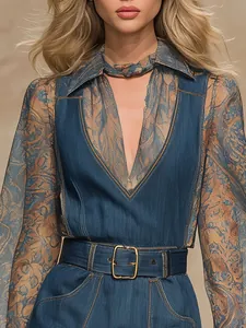 Close-up of professional women's blue denim jumpsuit featuring a V-neck and stylish gold buckle belt