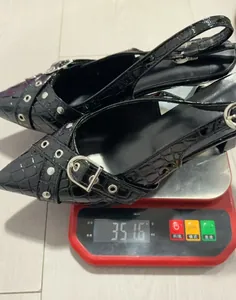 Detailed view of the black crocodile-textured slingback heel weighing 351.6 grams