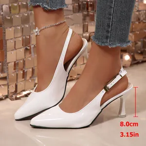 White patent leather pointed-toe slingback kitten heels with 8cm heel height detail