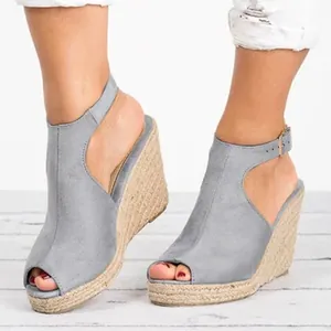 Stylish grey suede peep-toe wedge sandals with ankle strap and woven espadrille platform