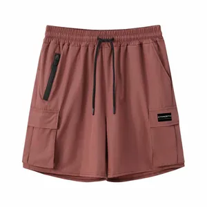 Detailed view of men's four-way stretch quick-dry cargo shorts in reddish-brown finish.