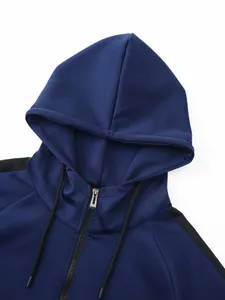 High-quality close-up detail of a navy blue men's sports hoodie with metal zipper