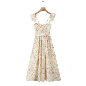 Detailed view of floral print summer dress with ruffled sleeves and waist-tie detail