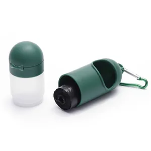 Detail of portable pet waste bag dispenser and hand sanitizer bottle with carabiner.