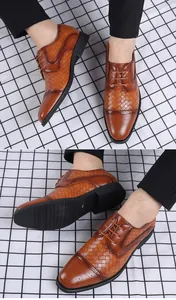 Detailansicht brauner geflochtener Leder-Herrenschuhe mit Brogue-Muster und rutschfester Sohle