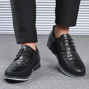 Stylish men's black leather lace-up casual shoes with a round toe design for autumn wear