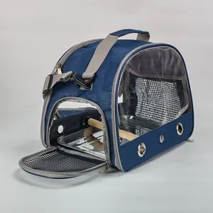 Detailed side view of open portable bird carrier with wooden perch and metal tray.