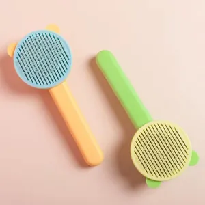 Cute bear-shaped pet grooming brush for cats and dogs with ergonomic handle, dual-color set.