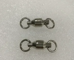 Macro view of two durable stainless steel universal swivel bearing rings for bird foot chains