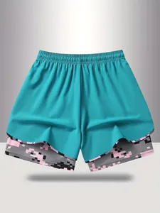 Detailed view showing the teal and pink pixel camo double-layer women's sports shorts