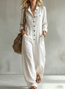 Loose white linen cargo jumpsuit with lapel collar and wide-leg pants for resort style