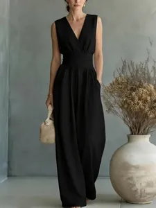 Elegant black sleeveless V-neck jumpsuit with a cinched waist and wide leg design