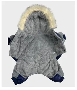 Interior detail of warm blue dog winter coat showing grey fleece lining and size tag
