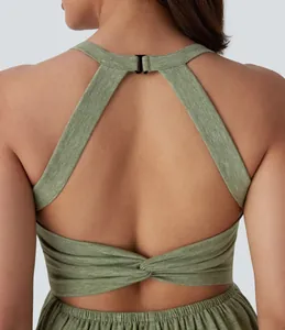 Detailed back view of women's stylish olive green dress with twist design and halter neck