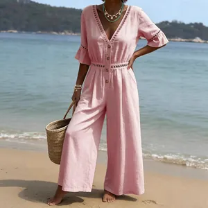 Elegant pink V-neck jumpsuit with lace trim and wide-leg trousers for resort wear