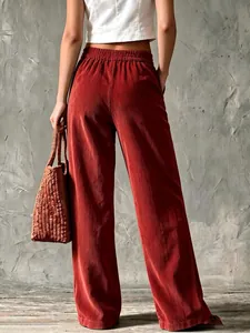 Detailed back view of vintage rusty-red corduroy wide-leg pants with elastic waist