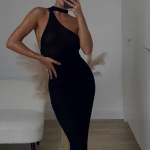 Detailed view of sexy one-shoulder black bodycon maxi dress for beach vacations
