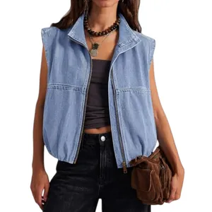 Detail view of a light blue washed denim vest featuring a functional zipper and stand collar