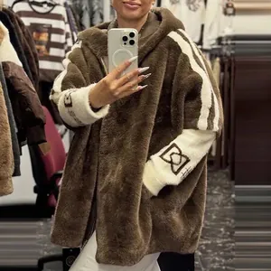 Detail view of fashion loose brown plush hooded jacket with white striped sleeve design