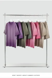 Vintage washed gradient cotton t-shirt and shorts set displayed on a metal rack.