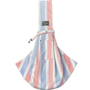 Detail of pink and blue striped pet sling bag with safety hook