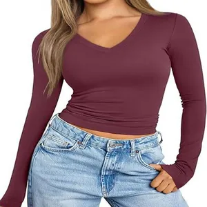 Detailed view of women's burgundy long-sleeve V-neck slim fit t-shirt with ribbed fabric