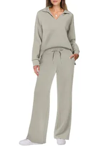 Detail view of women's long-sleeve sweatshirt and drawstring wide-leg pants set in sage green.