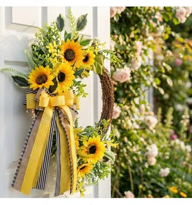 Detailed view of an autumn sunflower wreath with a decorative bow on a white door
