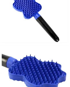 Close-up detail of blue silicone bristles on a pet massage and deshedding bath brush