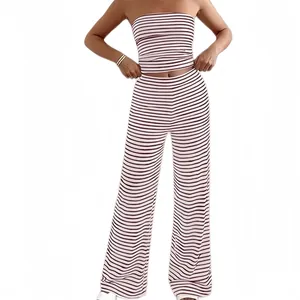 Close-up of a stylish striped two-piece set featuring a tube top and wide-leg pants.