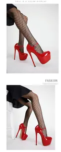 Professional studio detail of 17cm red patent leather high heel platform shoes.