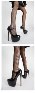 Detail view of 17cm black patent leather platform high heels with Mary Jane strap.