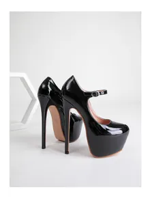 Detail of 17cm black patent leather platform high heels with adjustable ankle strap